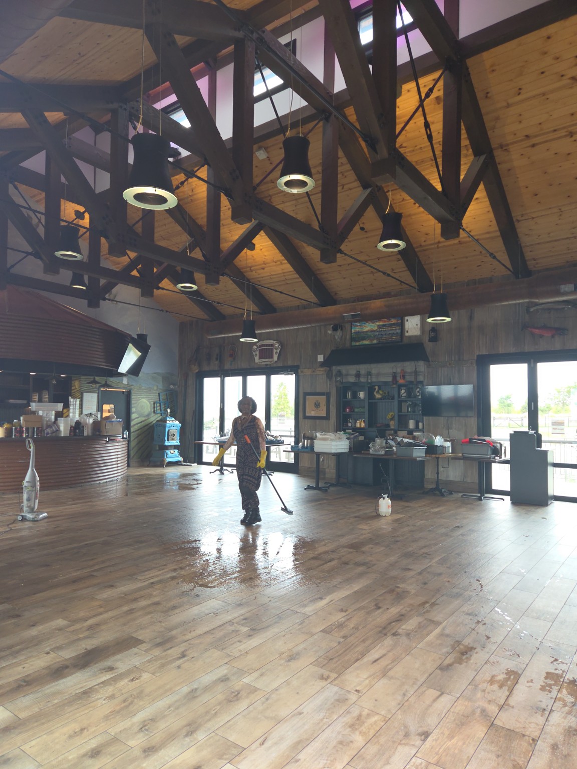 Northern Lights cleaner performing floor work in a large commercial event venue